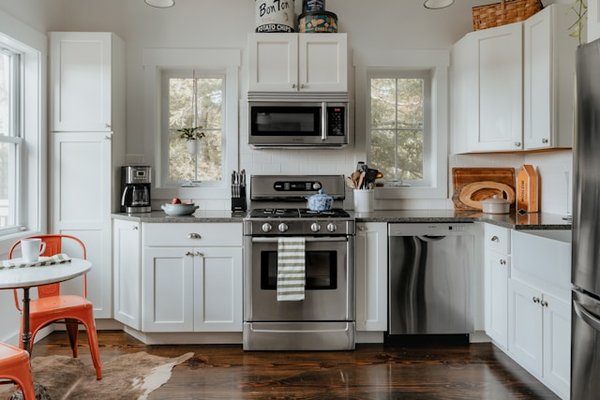 What are the best ways to utilize a kitchen corner cabinet for maximizing storage of healthy cooking tools?
